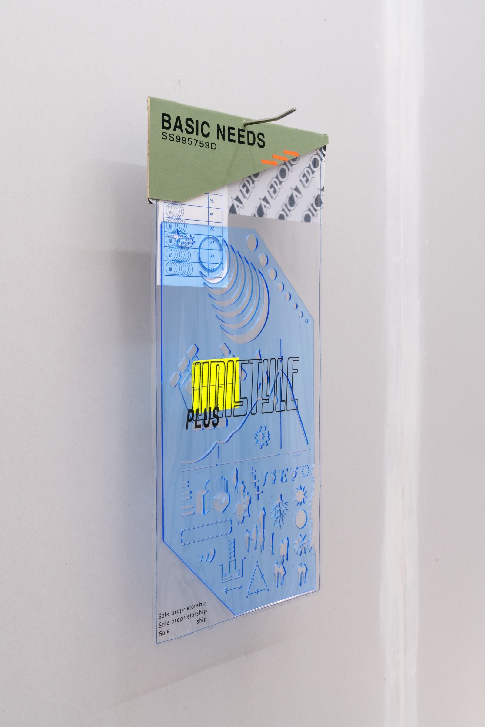 Wall-mounted packaging with an odd ruler inside.